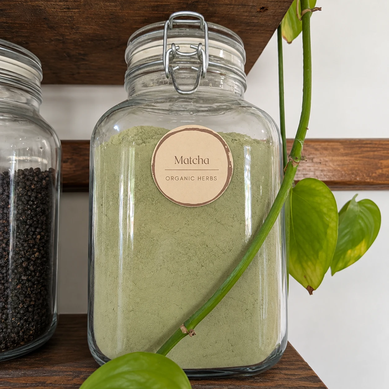 Matcha green tea in its glass display jar - enhanced shop photograph